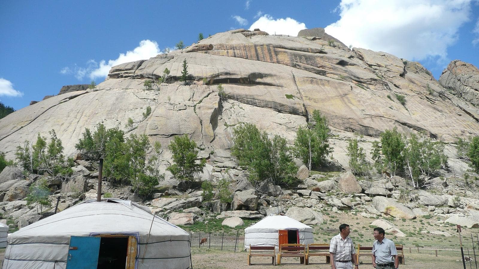 White gers beneath a granite outcrop in Gorkhi-Terelj